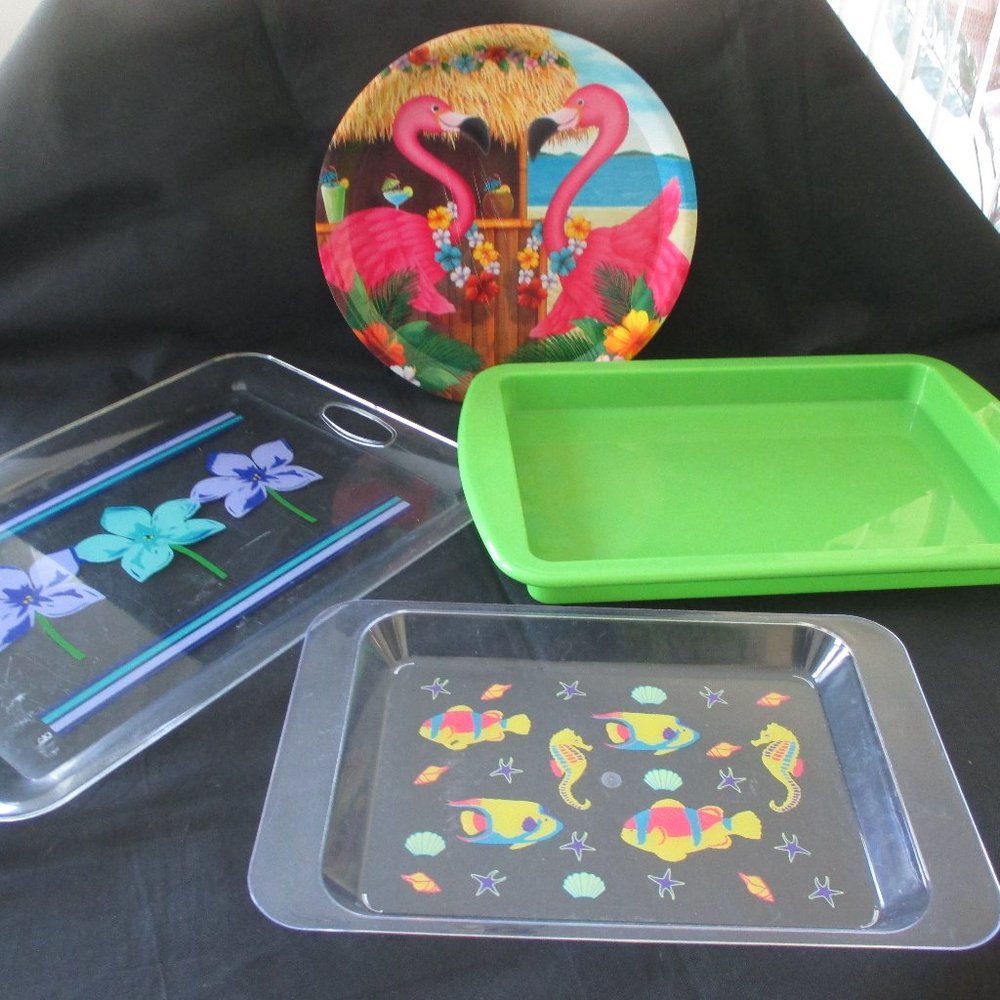 Four cute plastic serving trays - sizes  range from 10.5" x 16" to 14" x 19.5"